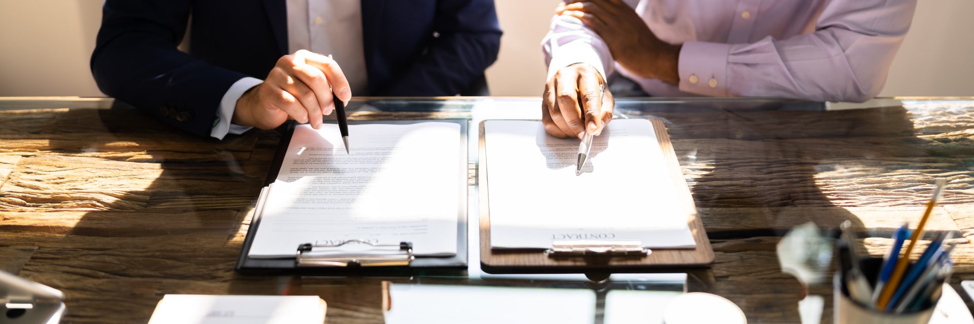 two people checking a legal document